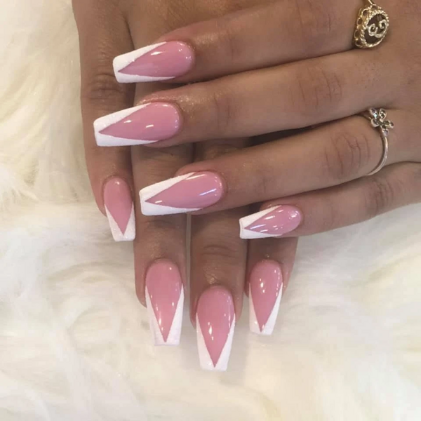 Long pink coffin nails with a sharp white chevron French tip